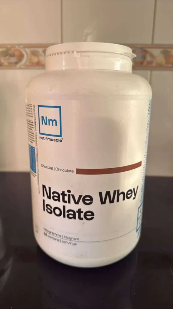 Nutrimuscle Native Whey Isolate tub on a table
