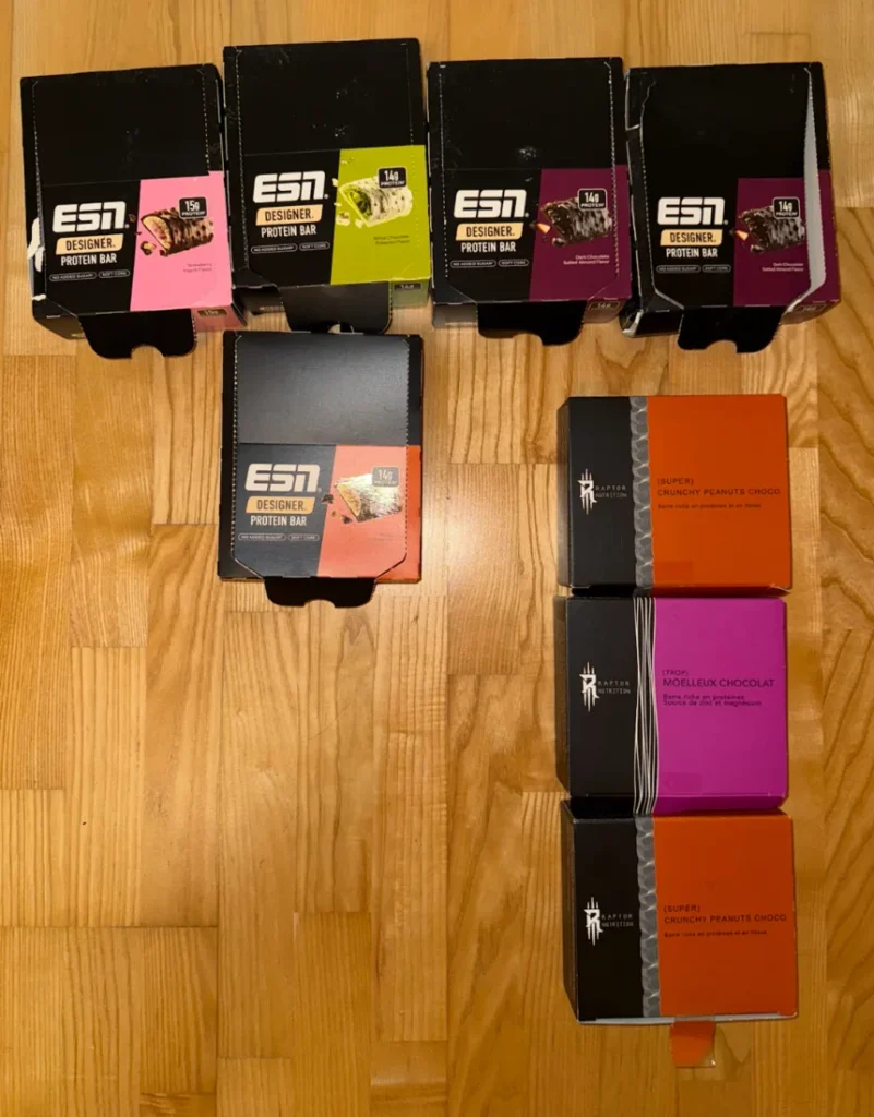 Boxes of ESN and Raptor Nutrition protein bars